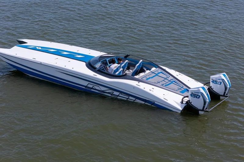 El Gato Yacht Photos Pics 2022 MTI 390X speedboat with dual outboard engines on calm water.