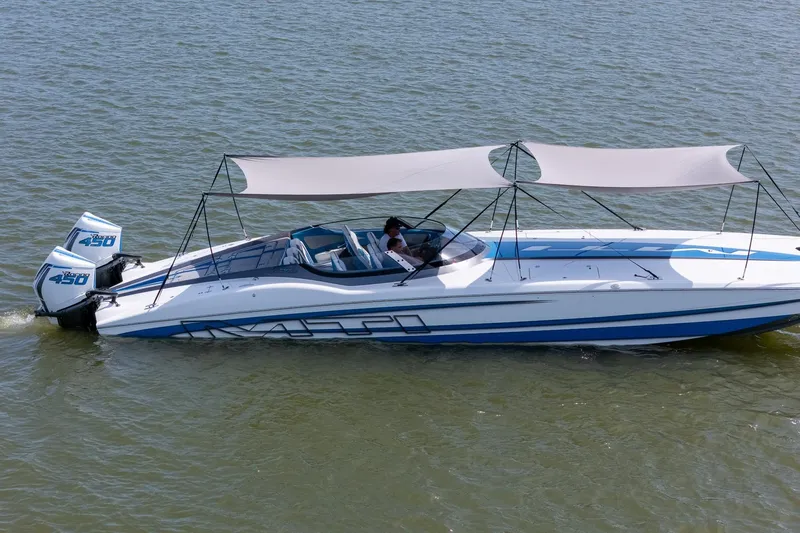 El Gato Yacht Photos Pics 2022 MTI 390X speedboat with dual engines and canopy on water.