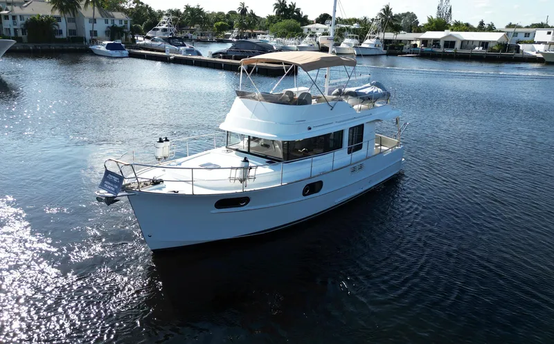 Next Chapter Yacht Photos Pics 2014 Beneteau Swift Trawler 44 cruising in a marina.