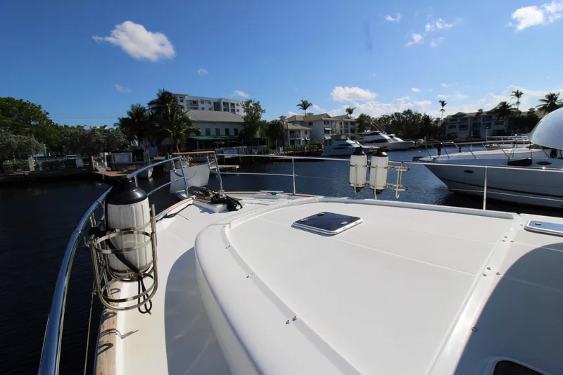 Next Chapter Yacht Photos Pics 2014 Beneteau Swift Trawler 44 docked in a marina, sunny day.