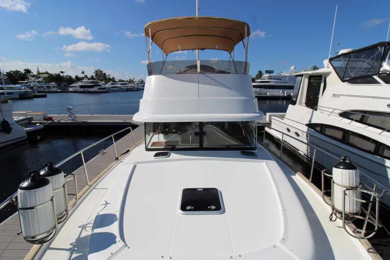 Next Chapter Yacht Photos Pics 2014 Beneteau Swift Trawler 44 docked at marina, front deck view.