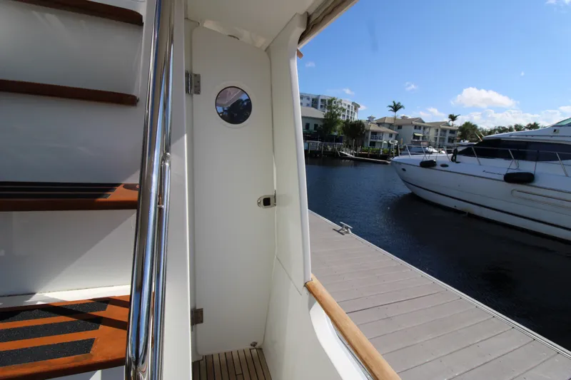 Next Chapter Yacht Photos Pics 2014 Beneteau Swift Trawler 44 side deck with dock view.