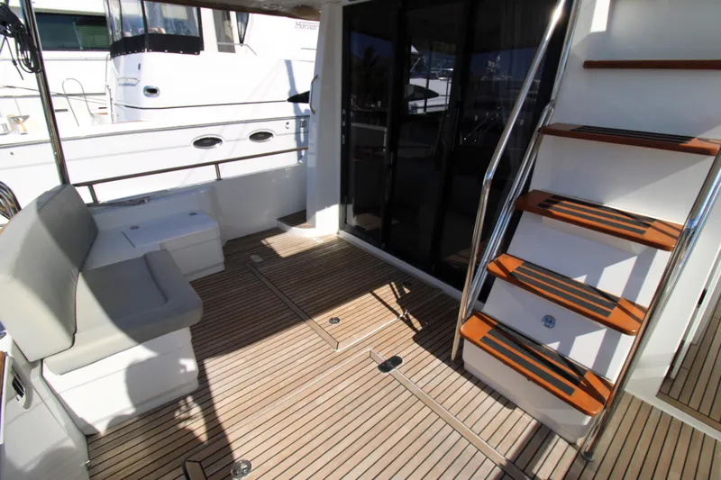 Next Chapter Yacht Photos Pics 2014 Beneteau Swift Trawler 44 deck with seating and stairs.