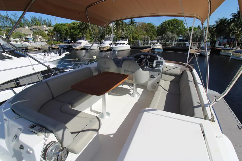 Next Chapter Yacht Photos Pics 2014 Beneteau Swift Trawler 44 flybridge with seating and helm station.