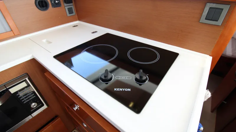 Next Chapter Yacht Photos Pics 2014 Beneteau Swift Trawler 44 kitchen with Kenyon electric cooktop.