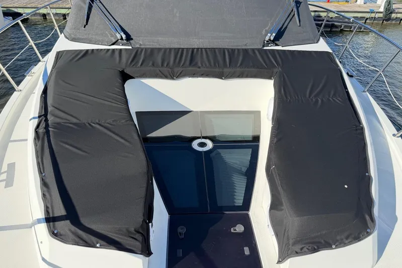  Yacht Photos Pics 2019 Galeon 470 Sky yacht with black cushioned deck and glass skylight.