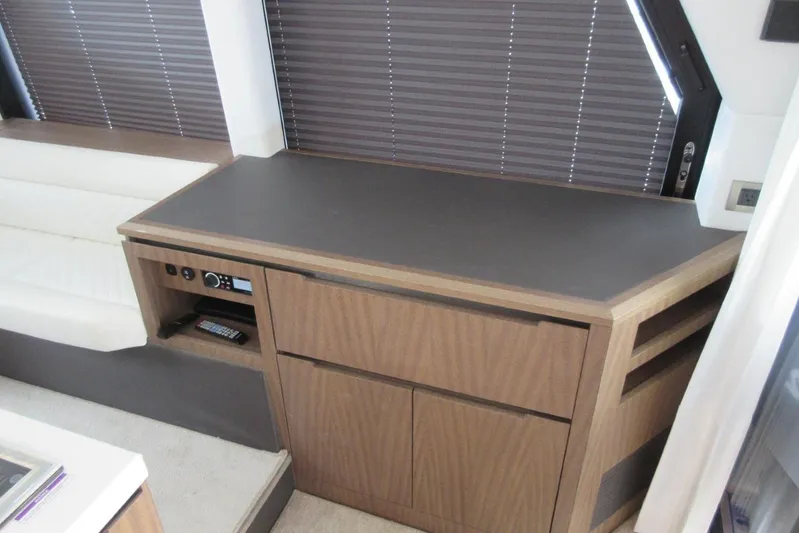  Yacht Photos Pics Interior of 2019 Galeon 470 Sky yacht with modern wood cabinetry and seating.