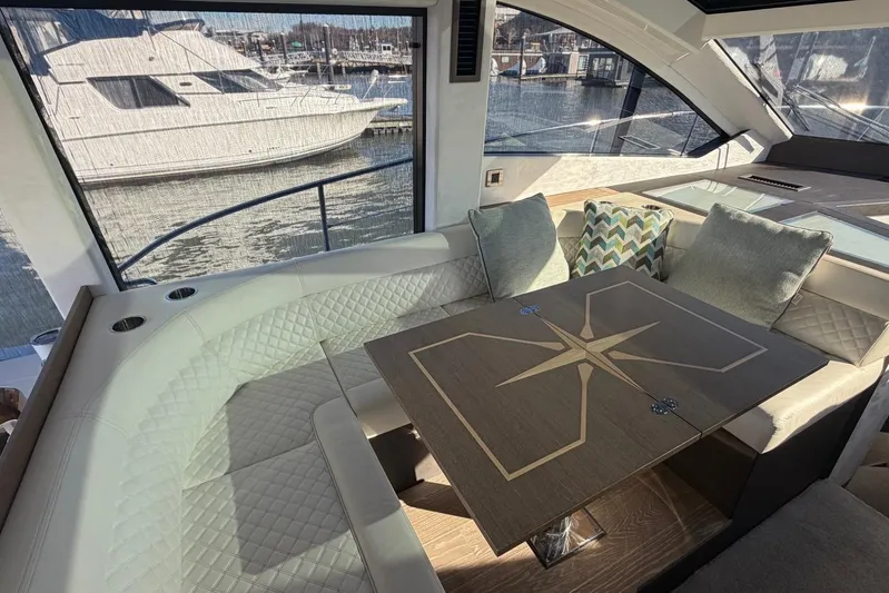  Yacht Photos Pics Luxurious interior of 2019 Galeon 470 Sky yacht with elegant seating and table.