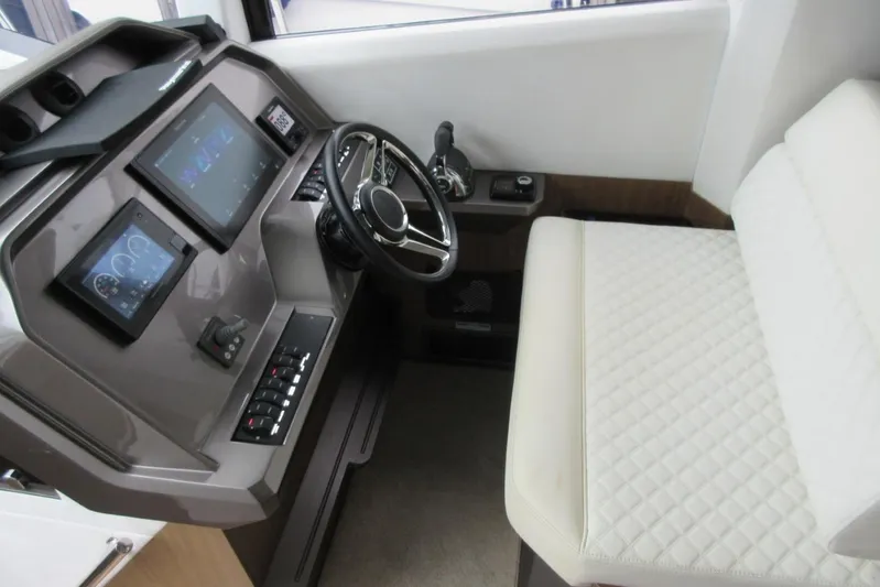  Yacht Photos Pics 2019 Galeon 470 Sky yacht helm with modern controls and quilted seating.