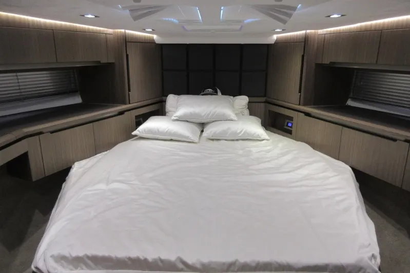  Yacht Photos Pics Luxurious bedroom interior of 2019 Galeon 470 Sky yacht with modern design and ambient lighting.