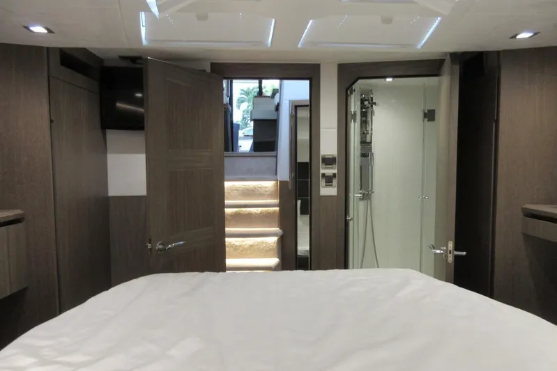  Yacht Photos Pics Luxurious interior of 2019 Galeon 470 Sky yacht with modern wood finish and elegant lighting.