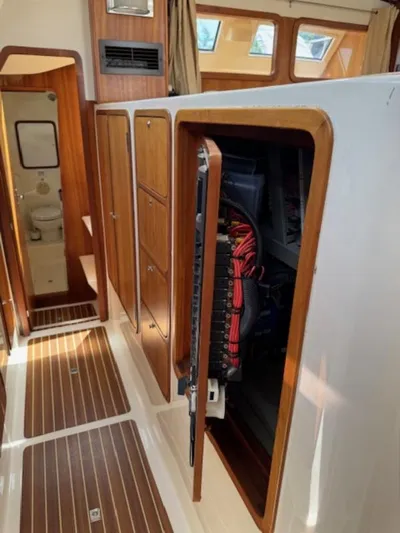 Bobcat Yacht Photos Pics Interior view of 2010 Cruiser Cats Havana 38 yacht, featuring wooden cabinetry and electrical panel.