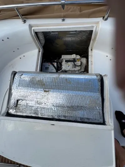 Bobcat Yacht Photos Pics Engine compartment of 2010 Cruiser Cats Havana 38 catamaran, featuring insulation and mechanical components.