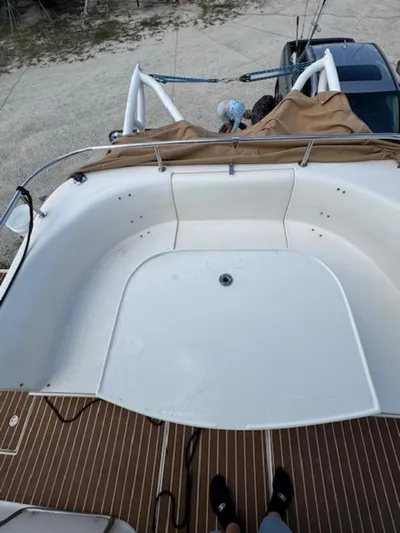 Bobcat Yacht Photos Pics Cruiser Cats Havana 38 boat deck, 2010 model, with white seating and wooden flooring.
