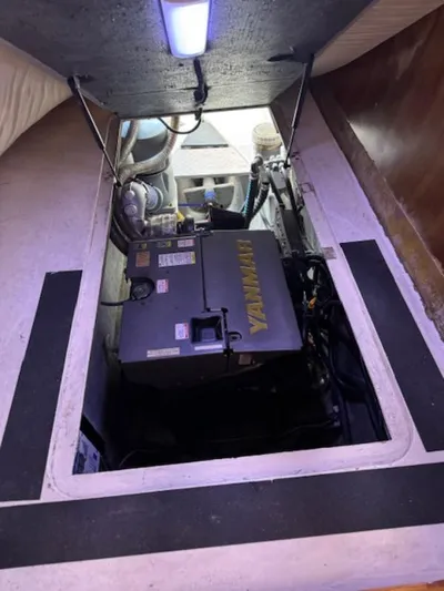 Bobcat Yacht Photos Pics Engine compartment of 2010 Cruiser Cats Havana 38 with visible machinery and lighting.