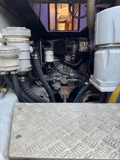 Bobcat Yacht Photos Pics Engine compartment of a 2010 Cruiser Cats Havana 38 catamaran, showcasing mechanical components.