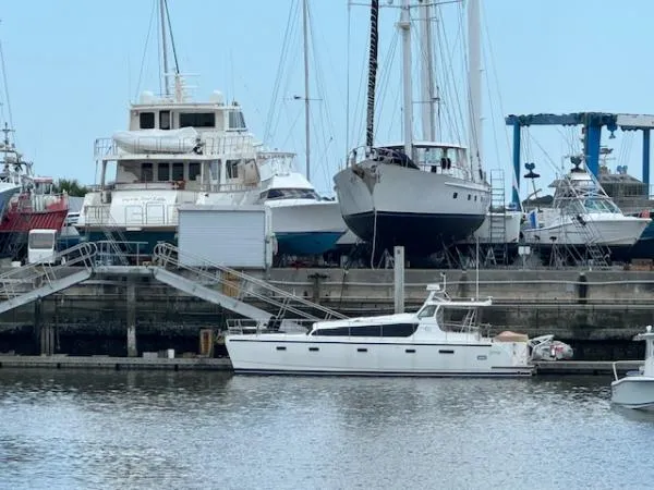 Bobcat Yacht Photos Pics Cruiser Cats Havana 38 catamaran docked at a marina, surrounded by various boats.