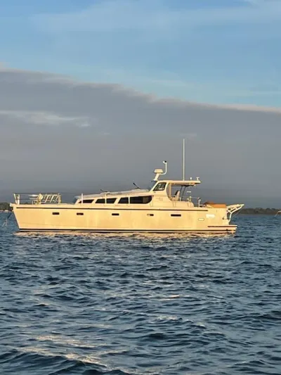 Bobcat Yacht Photos Pics 2010 Cruiser Cats Havana 38 yacht on calm water under a clear sky.