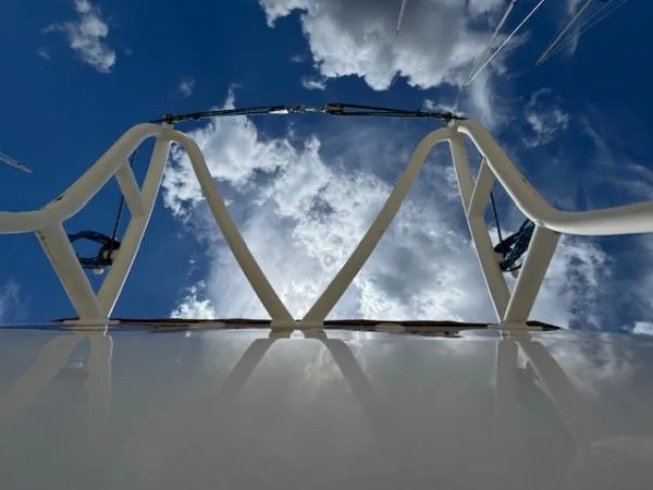 Bobcat Yacht Photos Pics Catamaran Havana 38 by Cruiser Cats, 2010, viewed from below against a cloudy sky.