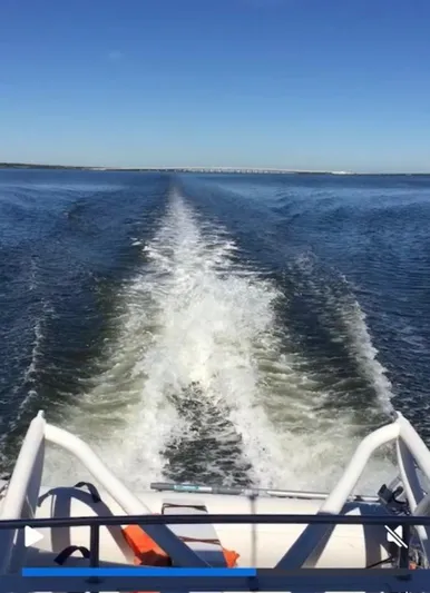 Bobcat Yacht Photos Pics Wake trail behind a 2010 Cruiser Cats Havana 38 on open water.