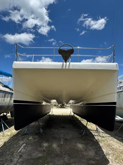 Bobcat Yacht Photos Pics 2010 Cruiser Cats Havana 38 catamaran on land, viewed from the front under a blue sky.