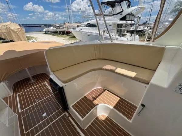 Bobcat Yacht Photos Pics 2010 Cruiser Cats Havana 38 yacht interior with cushioned seating and wooden flooring.