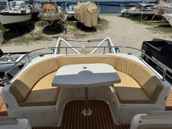 Bobcat Yacht Photos Pics Outdoor seating area on a 2010 Cruiser Cats Havana 38 catamaran, docked with other boats nearby.