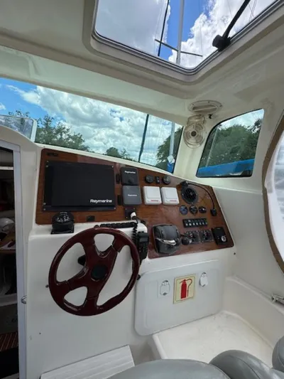 Bobcat Yacht Photos Pics Interior helm of 2010 Cruiser Cats Havana 38 with navigation equipment and steering wheel.