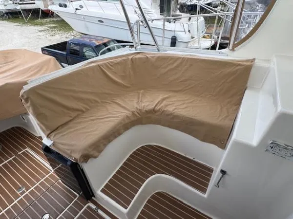 Bobcat Yacht Photos Pics 2010 Cruiser Cats Havana 38 boat with covered seating area and wooden deck.