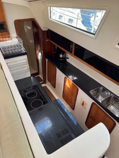 Bobcat Yacht Photos Pics Interior of 2010 Cruiser Cats Havana 38 yacht kitchen with modern appliances and sleek design.