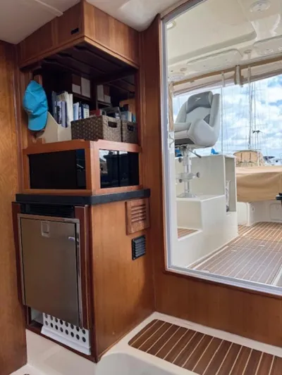 Bobcat Yacht Photos Pics Interior of 2010 Cruiser Cats Havana 38, featuring wooden cabinetry and modern amenities.