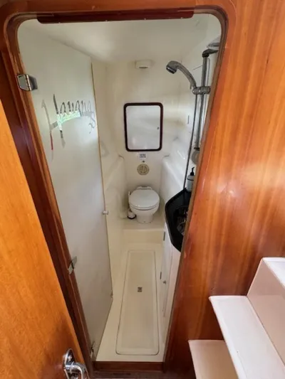 Bobcat Yacht Photos Pics Compact bathroom in 2010 Cruiser Cats Havana 38 yacht, featuring shower and toilet.
