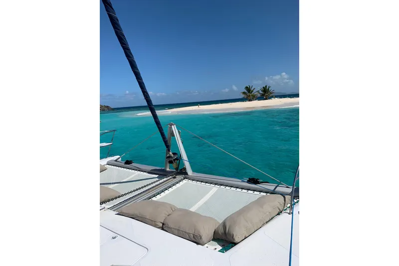 Chef De Mere Yacht Photos Pics Catamaran sailing near tropical island, clear blue water, Royal Cape Catamarans 50, 2006 model.