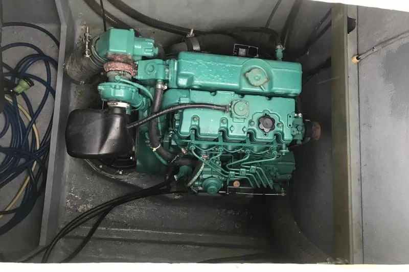 Chef De Mere Yacht Photos Pics Engine compartment of a 2006 Royal Cape Catamarans 50, featuring a green marine engine.