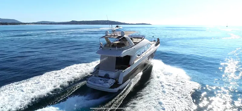  Yacht Photos Pics Prestige 620 yacht cruising on open sea, 2013 model, leaving a wake behind.