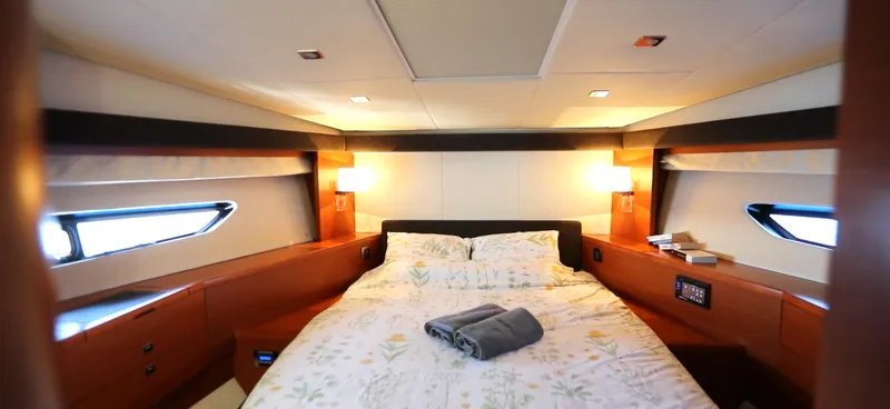  Yacht Photos Pics Luxurious bedroom interior of 2013 Prestige 620 yacht with elegant lighting and bedding.