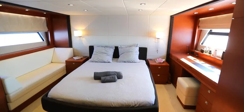  Yacht Photos Pics Luxurious cabin interior of 2013 Prestige 620 yacht with bed, seating, and desk.