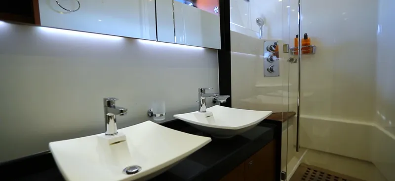  Yacht Photos Pics Luxurious bathroom in 2013 Prestige 620 yacht with dual sinks and modern shower.