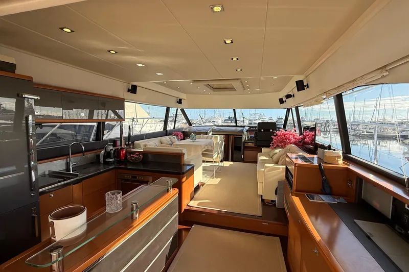  Yacht Photos Pics Luxurious interior of a 2013 Prestige 620 yacht with modern furnishings and panoramic windows.