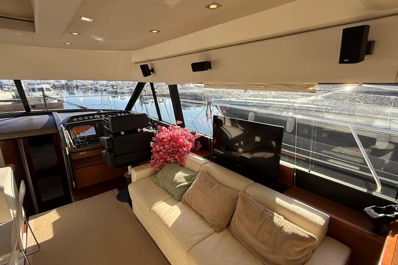  Yacht Photos Pics Luxurious interior of a 2013 Prestige 620 yacht with plush seating and modern amenities.