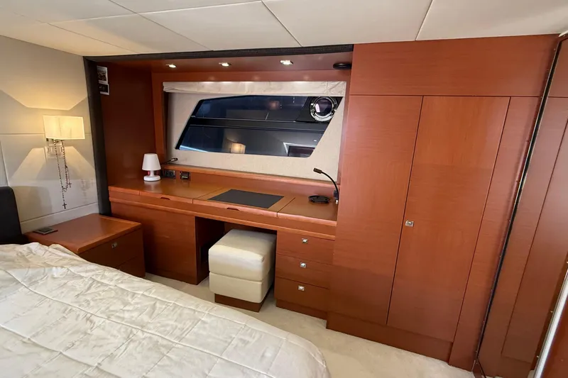  Yacht Photos Pics Luxurious cabin interior of 2013 Prestige 620 yacht with wooden furnishings and elegant decor.