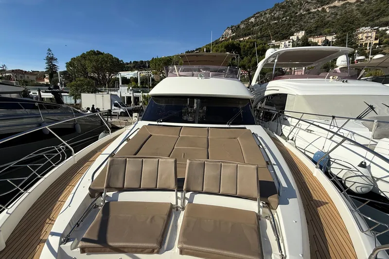  Yacht Photos Pics Luxurious 2013 Prestige 620 yacht with sunbathing deck, docked in scenic marina.