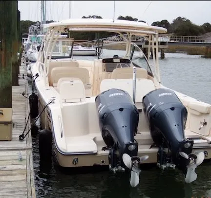 Badger Yacht Photos Pics 2015 Grady-White Freedom 307 boat docked with dual outboard engines.