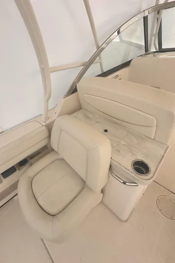 Badger Yacht Photos Pics 2015 Grady-White Freedom 307 boat interior with beige seating and cup holder.