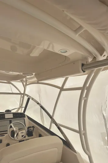 Badger Yacht Photos Pics 2015 Grady-White Freedom 307 boat interior with helm and canopy.