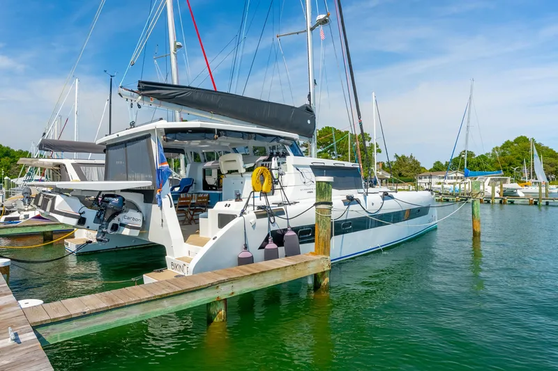 Carolina Red Yacht Photos Pics 2024 St Francis 460 catamaran docked at marina under clear blue sky.