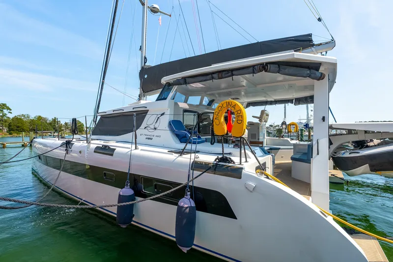 Carolina Red Yacht Photos Pics 2024 St Francis 460 catamaran docked in a marina, featuring sleek design and modern amenities.
