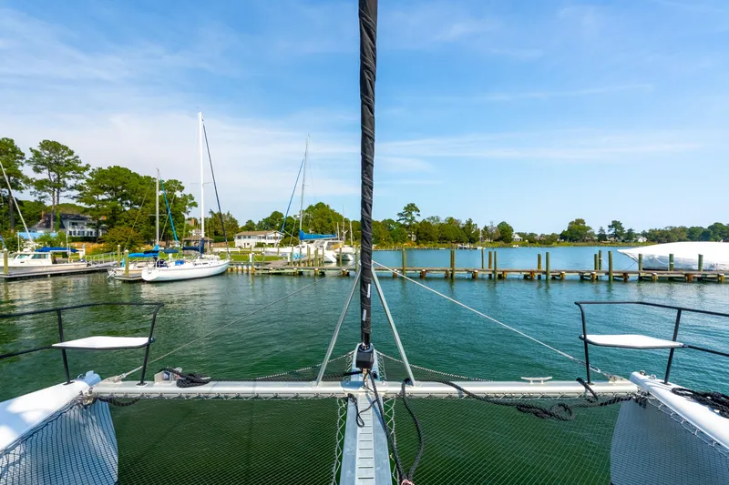 Carolina Red Yacht Photos Pics Sailing view from 2024 St Francis 460 catamaran in a serene marina setting.