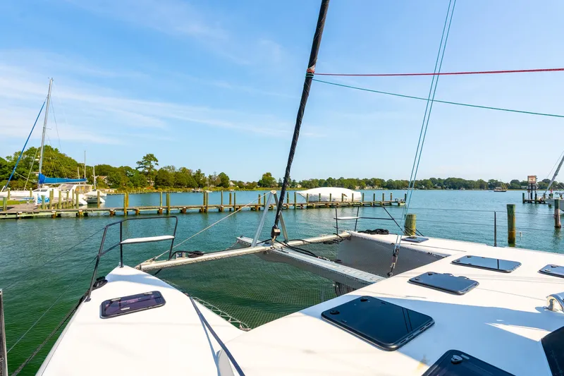Carolina Red Yacht Photos Pics 2024 St Francis 460 catamaran docked in a serene marina with clear blue skies.