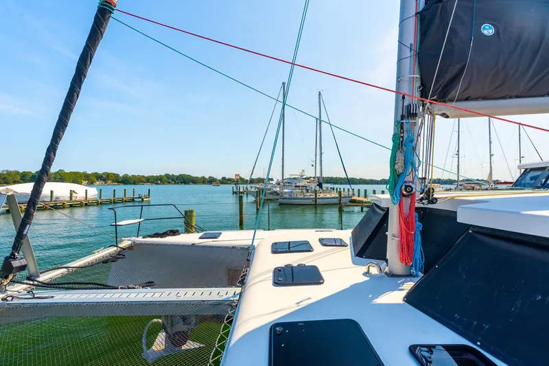 Carolina Red Yacht Photos Pics 2024 St Francis 460 catamaran docked in a scenic marina with clear blue skies.